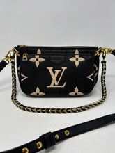 Louis Vuitton Bag, Bicolor Monogram Empreinte Leather
Multi Pochette Accessoires