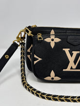 Louis Vuitton Bag, Bicolor Monogram Empreinte Leather
Multi Pochette Accessoires