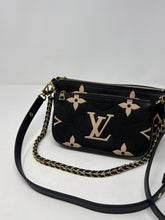 Louis Vuitton Bag, Bicolor Monogram Empreinte Leather
Multi Pochette Accessoires